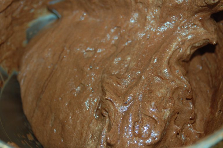 Fold in portions of the chocolate mixture at a time.  Take your time to continue to fold until the chocolate is fully incorporated.  Resist the urge to stir.  You want to maintain the airy lightness of the egg whites.